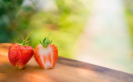 fresh strawberries in wooden bowl. Summer garden. Seasonal fruit.の写真素材