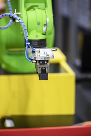 Robotic programmed robot arm. Industrial exhibition of machine tools.