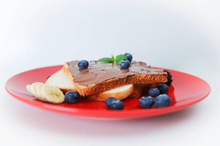 Toast with chocolate and nut paste and berry.の写真素材