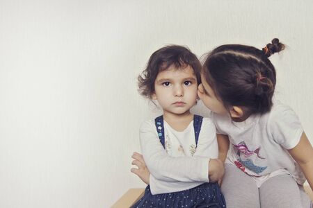 Offended girl tries to console another girlの写真素材