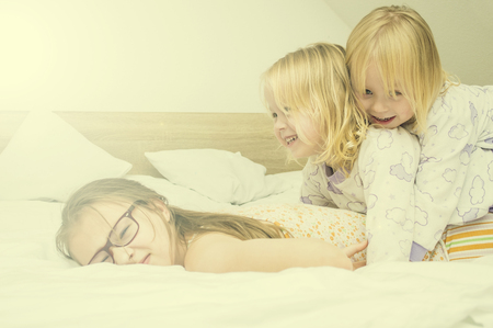 pillow fight, childrenPillow fight. Games with younger sisters. Nobody can find me. Happy weekend.の写真素材