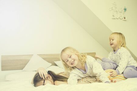 children pillow fight. Games with younger sisters.の写真素材