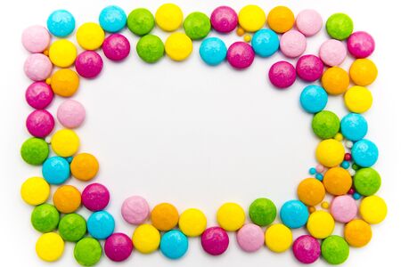 bright candy on a white background spread out in the form of a frame,の写真素材