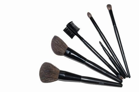 cosmetic makeup brushes lying on the tableの写真素材
