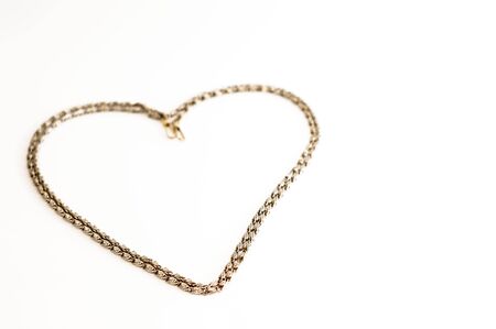 Thick golden chain - heart frame. Jewelry decoration.の写真素材