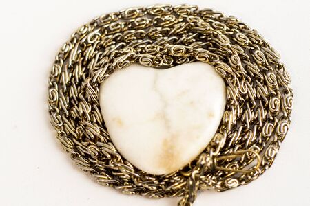 Thick golden chain - heart frame. Jewelry decoration.の写真素材