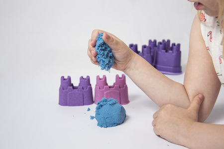 Fun kinetic sand. Child building sandcastleの写真素材