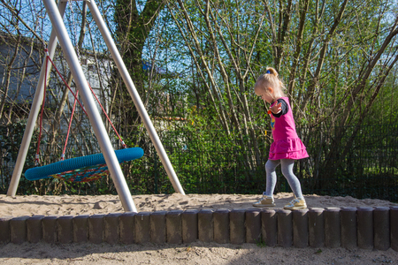 A girl on the playground, a childrens game and activityの写真素材