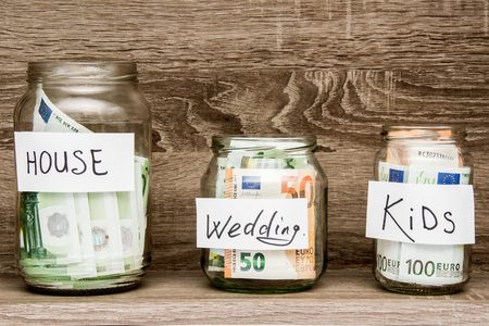 money in a glass jar, the concept of a happy familyの写真素材