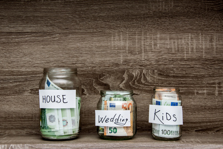 money in a glass jar, concept of family developmentの写真素材