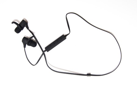 in-ear headphones for sports on a white backgroundの写真素材