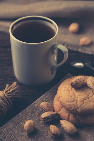 A cup of black tea with cookies.の写真素材