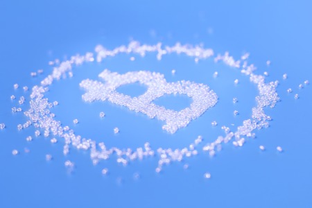 Symbol of bitcoin from beads on a blue backgroundの写真素材