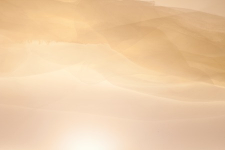 Abstract bright colorful fabric background in the form of a waveの写真素材