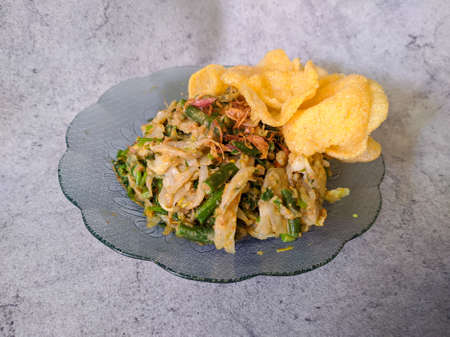 Traditional Indonesian Salad Food. Lotek Or Gado Gado. various kind of Vegetable with Peanut Sauce and crackers (Kerupuk)の写真素材