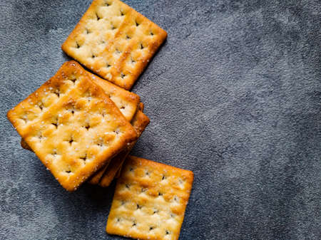Stack of Sweet Crunchy Crackers isolated on abstract background. Flat Lay.の写真素材