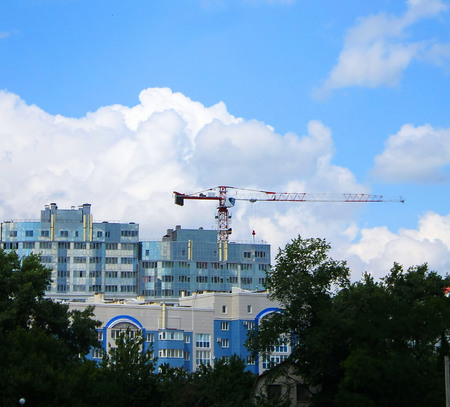 construction of a multistory building in the city with a craneの写真素材