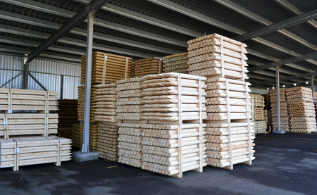 lumber stacked in piles in stockの写真素材
