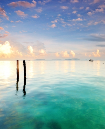 Turquoise ocean and two polesの写真素材