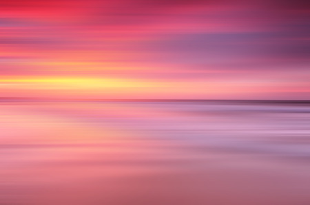 Abstract sunset background at the beach with long exposure effectの写真素材