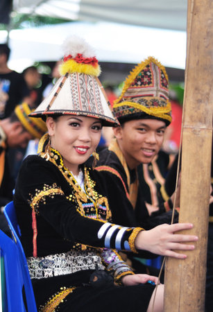 Kota Kinabalu, Sabah, Malaysia - MAY 30 2014: Kadazan Dusun teenagers from Borneo Tribe in traditional Kadazan Dusun costumes during the Sabah State Harvest Festival celebration.のeditorial素材