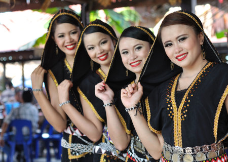 Kota Kinabalu, Sabah, Malaysia - MAY 30 2014: Kadazan Dusun Women from Borneo Tribe in traditional Kadazan Dusun costumes during the Sabah State Harvest Festival celebration.のeditorial素材