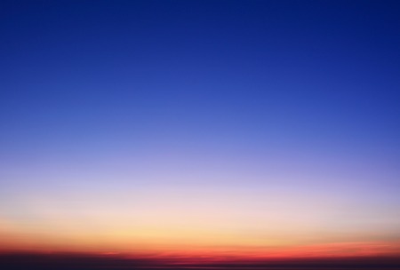 Vignette sunset sky gradient from Red to Orangeの写真素材