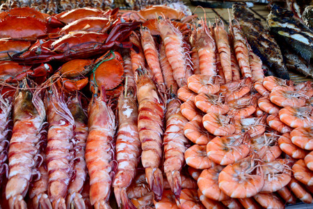 Grilled prawns crabs fish and other seafood displayed at Kota Kinabalu night market Sabah Borneo Malaysiaの写真素材