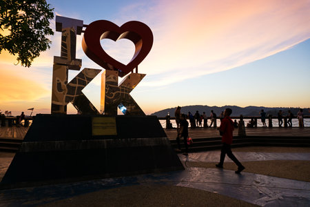 Kota Kinabalu, Malaysia - August 01, 2017: Back lit of the new landmark "I LOVE KK" at sunset.The cityâs new landmark at Segama Waterfront built to further accentuate the beauty of the state capital.のeditorial素材