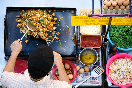 Top view of unidentified man cooking a fried radish turnip with vegetables at the food street stall in Kota Kinabalu, Sabah Borneo.の写真素材