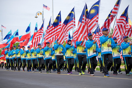 Kota Kinabalu, Malaysia - August 31, 2017: Malaysian flag carrier marching during 60th Independence Day celebration in Kota Kinabalu city, Sabah State.のeditorial素材