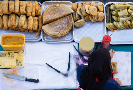 Top view of unidentified stall vendor selling variety of Malaysian food, cakes and dessert in Kota Kinabalu, Sabah Borneo, Malaysia.の写真素材