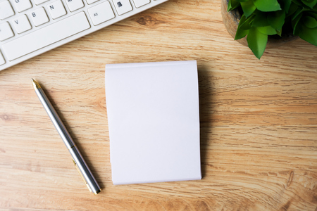 Blank open notepad and pen on top of office desk, retro style.の写真素材