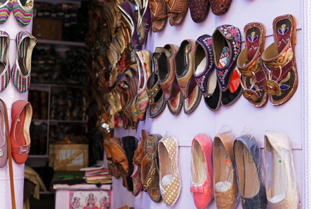 Mandawa, India - February 24, 2018: Shoe's shop with colorful shoes display in Mandawa town, Rajasthan.のeditorial素材