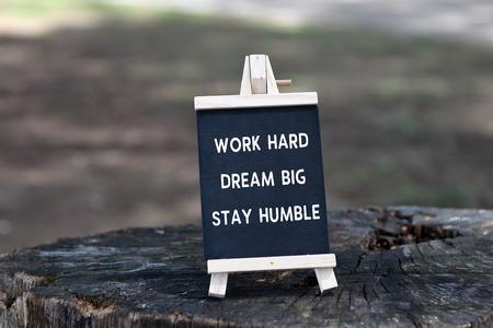 Inspirational quote - Work hard, dream big, stay humble, on black board.