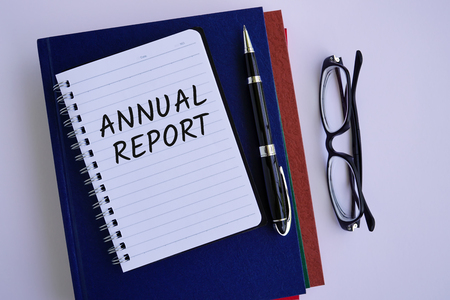 Annual report text on notepad, business conceptの写真素材