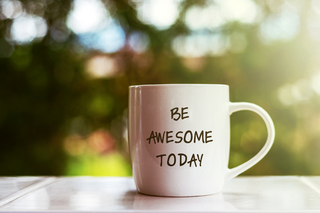 Inspirational quotes text on coffee mug - Be awesome todayの写真素材