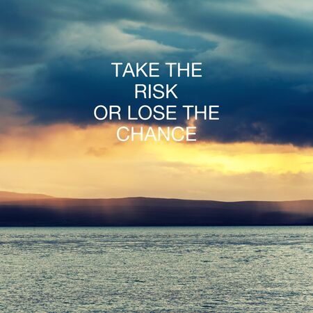 Motivational and inspirational quote - Take the risk or lose the change.の写真素材