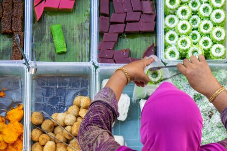 Top view of unidentified vendor at the food stall in Kota Kinabalu city food market, Sabah,...