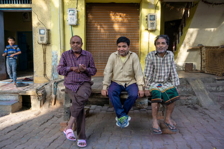 New Delhi, India - March 03, 2018:  Indian men sitting outside their house in a village in New Delhi