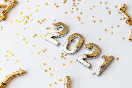 New Year Concept - Number 2021 With Star Shape Glitters on White Background