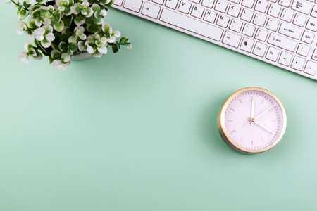 Directly above office desk with alarm clock and potted plant