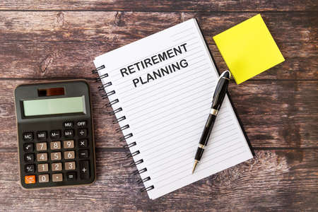 Retirement Planning on Note Pad With calculator and Penの写真素材