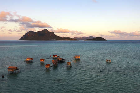 Sunset over tropical island new Maiga island near Bohey Dulang