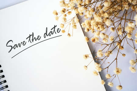 Save the date notice with baby's breath flowerの写真素材