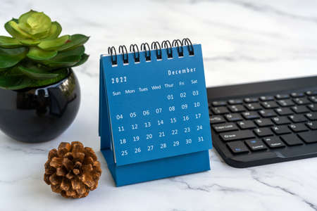December 2022 desk calendar on top of office deskの写真素材