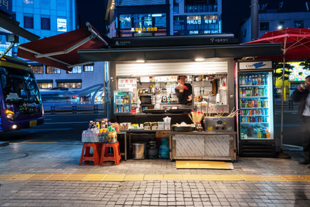 Seoul, South Korea - November 04, 2019: Food stall near Myeongdong underground shopping center entrance. Myeong Dong district is a popular shopping and street food market in Seoul city.のeditorial素材