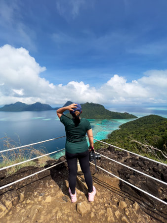 Woman at the peak of Bohey Dulang Island in Semporna Sabah Borneo Malaysiaの写真素材