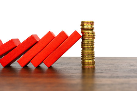 Wood block with stack of coins safety and protection conceptの写真素材