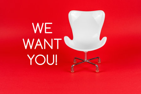 White chair on red background with text - We want youの写真素材